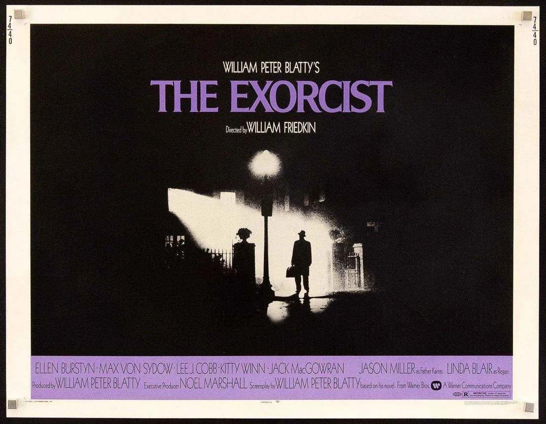 The Exorcist poster artwork shows a lone figure standing beneath a bright window outside a house.