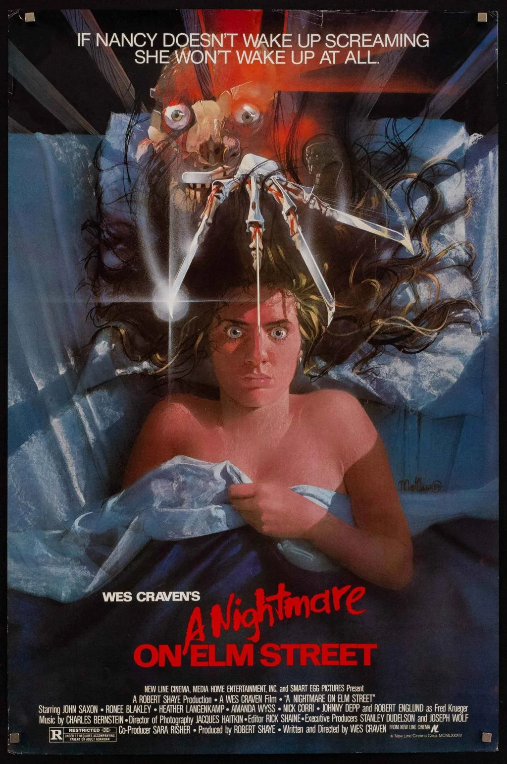 A Nightmare on Elm Street theatrical artwork, with Freddy looming above a frightened dreamer.