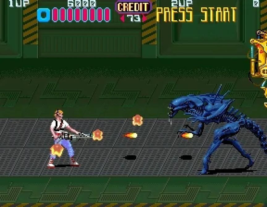 Konami’s Aliens arcade game shows an armed character firing toward a large Xenomorph.